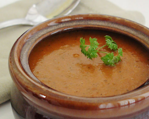 spicy vegetable soup in a bowl with parsley