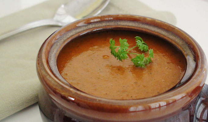 spicy vegetable soup in a bowl with parsley