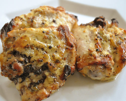 cooked yogurt marinated chicken thighs on a plate