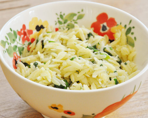 garlic parmesan orzo in a floral bowl
