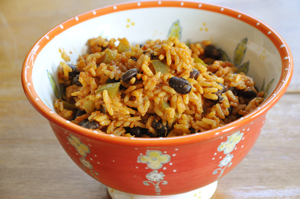 The perfect side dish for Mexican night is this recipe for Mexican rice loaded with black beans, green peppers and spices. | livinglou.com