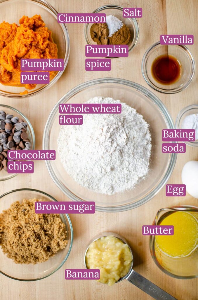 Ingredients for muffins in bowls on a board.