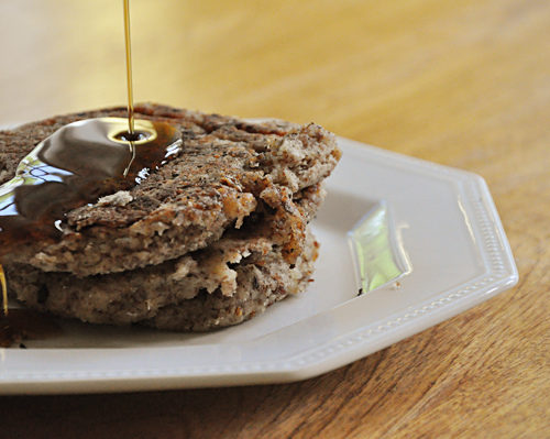 A stack of vegan pancakes with a drizzle of maple syrup