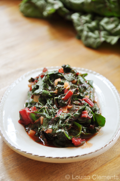 A plate of tomato garlic swiss chard