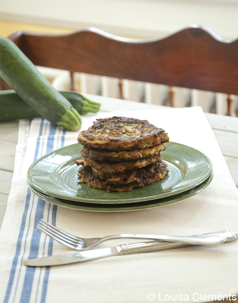 A stack of zucchini fritters on a plate