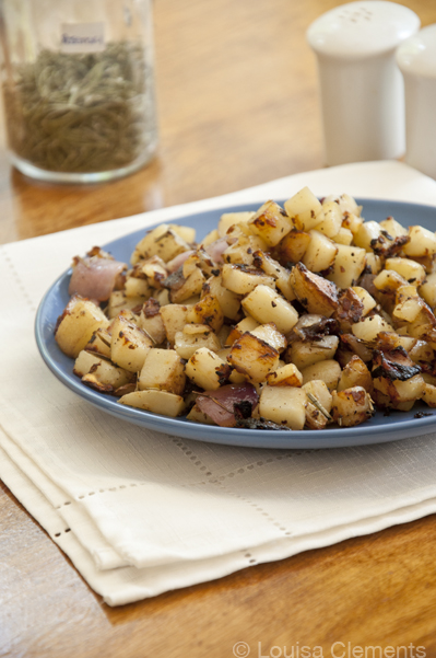 Rosemary skillet potatoes on a plate with a white napkin