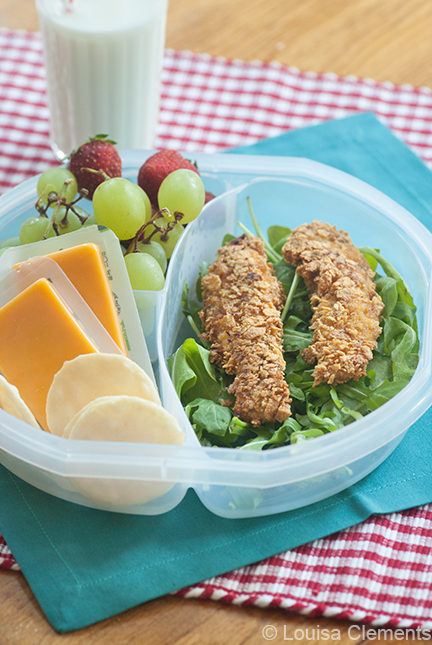 corn flake crusted chicken strips in a lunch container