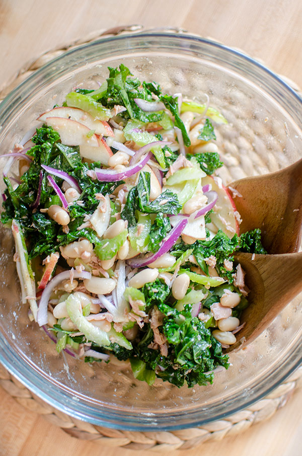 kale white bean salad in a glass bowl