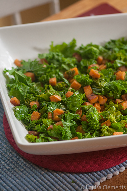 Sauteed kale with sweet potatoes in a white bowl