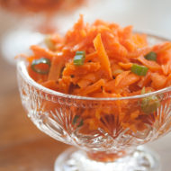 Carrot ginger slaw in a glass dish