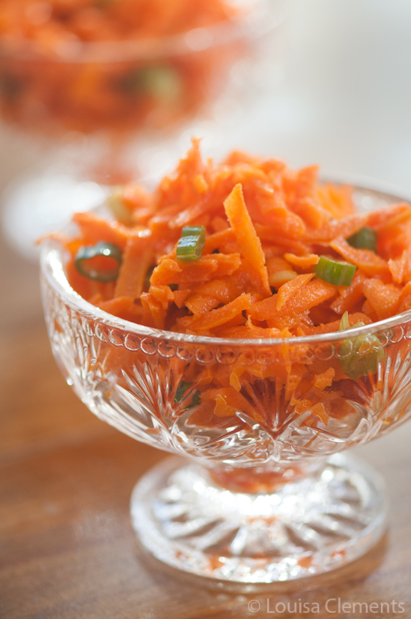 Carrot ginger slaw in a glass dish