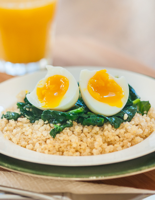 Start your morning off on the right foot with this protein packed, savoury breakfast of a soft boiled egg over quinoa and spinach. | livinglou.com