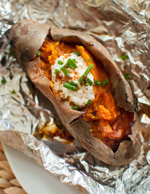 baked sweet potatoes on the barbecue