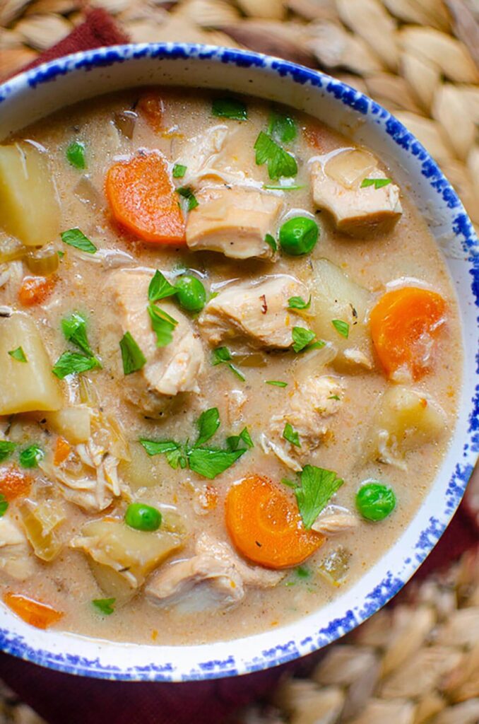 Closeup of slow cooker chicken stew in a bowl.