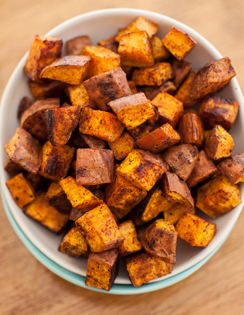 cinnamon chili roasted sweet potatoes in a bowl