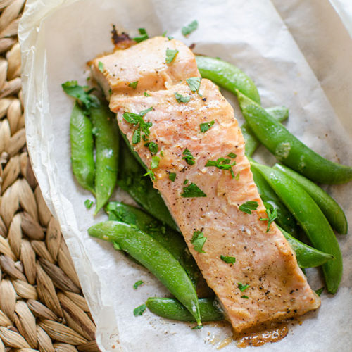 Finished miso salmon on top of sugar snap peas on parchment paper.