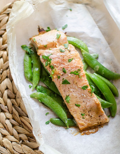 Finished miso salmon on top of sugar snap peas on parchment paper.
