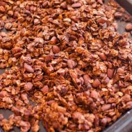 A sheet pan with freshly baked honey almond granola