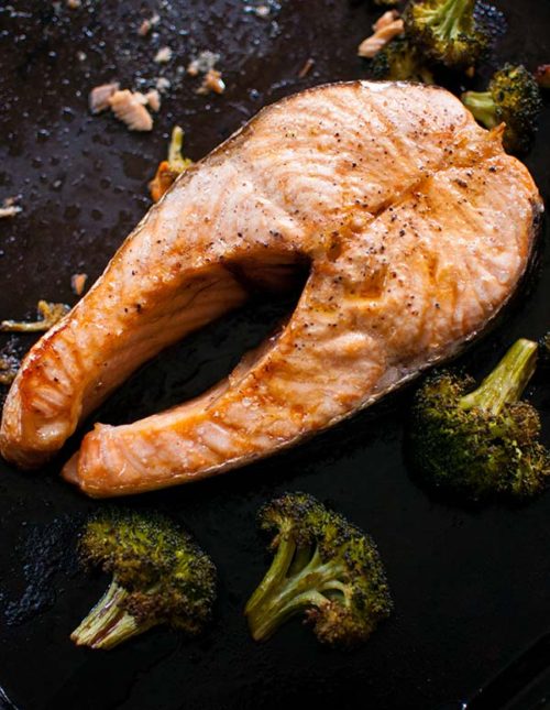 One pan and five ingredients is all it takes for this recipe for one sheet roasted salmon steaks and broccoli. | livinglou.com