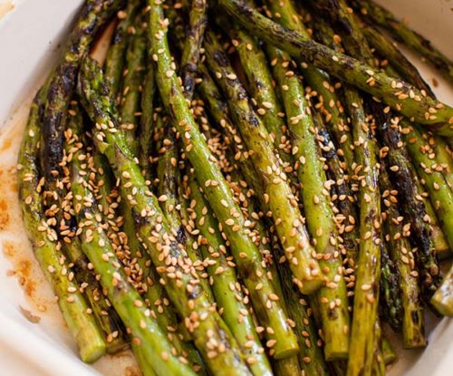 Grilled asparagus is a delicious side dish. Add some Asian flavour by tossing with a simple sesame dressing. | livinglou.com