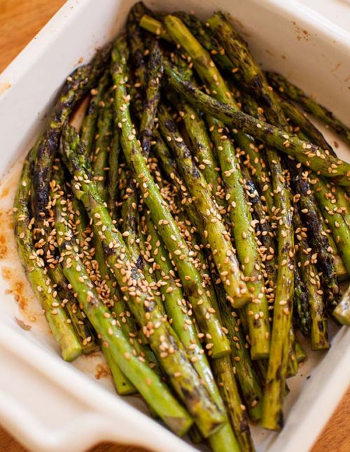 Grilled asparagus is a delicious side dish. Add some Asian flavour by tossing with a simple sesame dressing. | livinglou.com