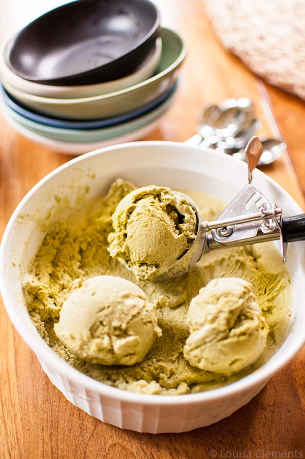 Churned ice cream in a container with an ice cream scoop