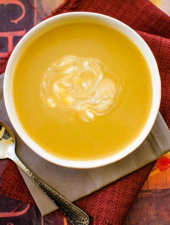 With aromatic fall spices like nutmeg and cinnamon, this creamy and spiced acorn squash soup is light and perfect for cool fall days. | livinglou.com