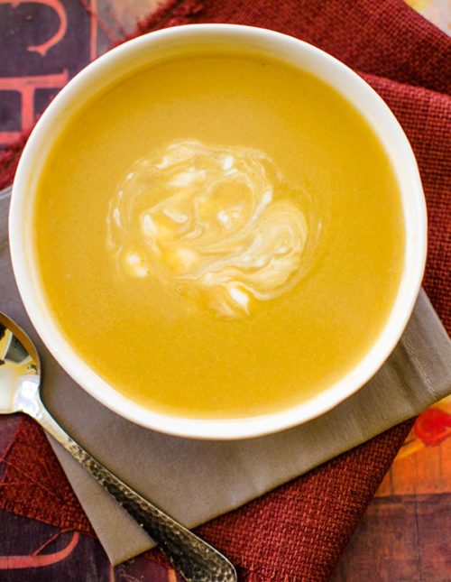 With aromatic fall spices like nutmeg and cinnamon, this creamy and spiced acorn squash soup is light and perfect for cool fall days. | livinglou.com