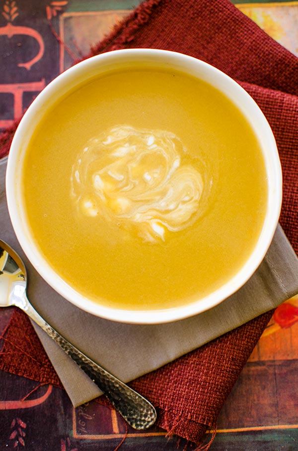 With aromatic fall spices like nutmeg and cinnamon, this creamy and spiced acorn squash soup is light and perfect for cool fall days. | livinglou.com