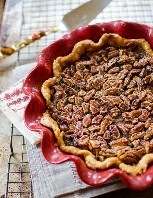 Combine everyone's two favourite pies for a decadent pumpkin pecan pie. The bottom layer is pumpkin and the top layer, a gooey pecan. | livinglou.com