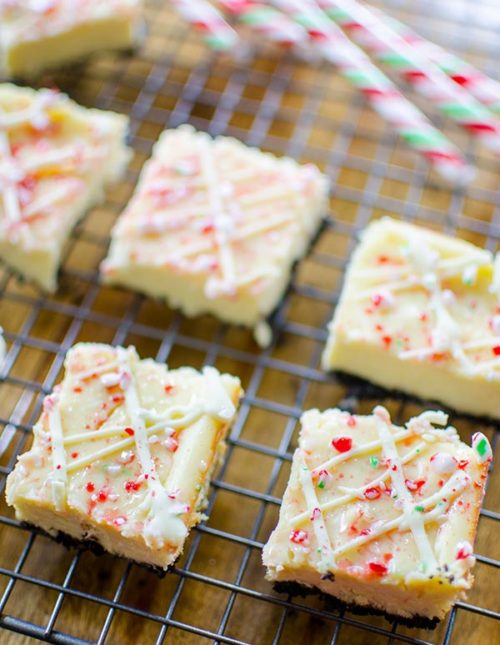 Peppermint cheesecake bars are the ultimate make-ahead potluck dessert. With an oreo base, white chocolate and crushed candy canes. | livinglou.com