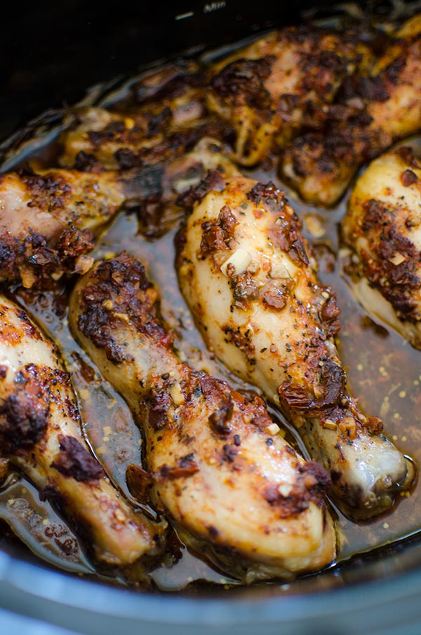 Let your slow cooker do all the work with this flavourful and simple recipe for slow cooker chicken legs with sun-dried tomatoes. | livinglou.com