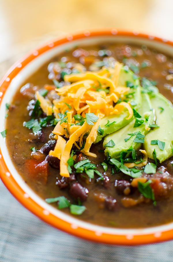 A healthy vegetarian soup recipe, this slow cooker black bean soup is so easy to make and loaded with spice, black beans and carrots. | livinglou.com