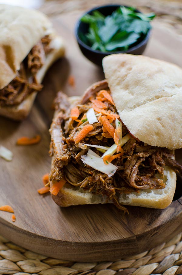 Make a big batch of slow cooker pulled pork with a healthy twist with carrots, pineapple juice and jalapeños. | livinglou.com