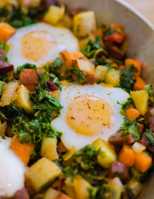 Start your day off on the right foot with this healthy breakfast recipe for kale and sweet potato hash with chorizo and eggs. | livinglou.com