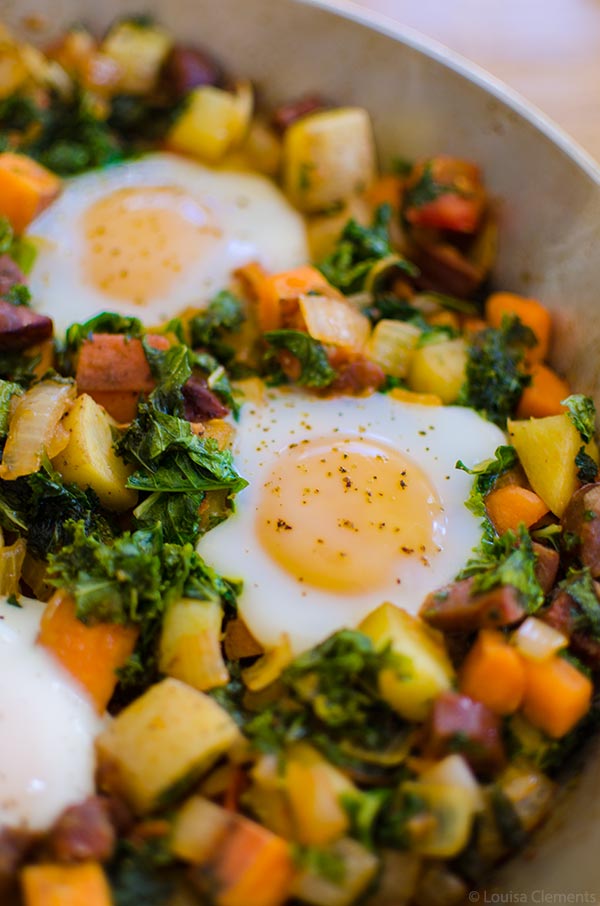 Start your day off on the right foot with this healthy breakfast recipe for kale and sweet potato hash with chorizo and eggs. | livinglou.com