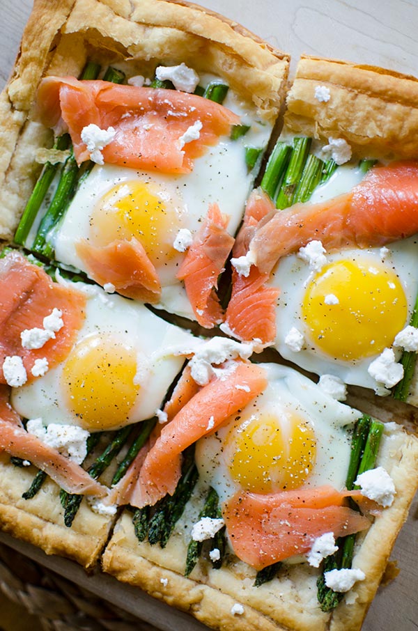 An impressive but simple brunch dish, this recipe for asparagus and egg tart with smoked salmon on a puff pastry crust will become a favourite. | livinglou.com