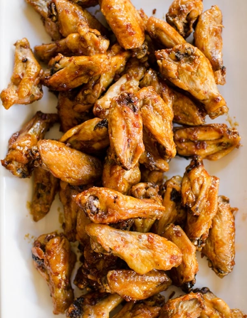 Make your favourite wings in the oven with this crispy recipe for baked teriyaki chicken wings made with baking powder and a homemade teriyaki sauce. | livinglou.com