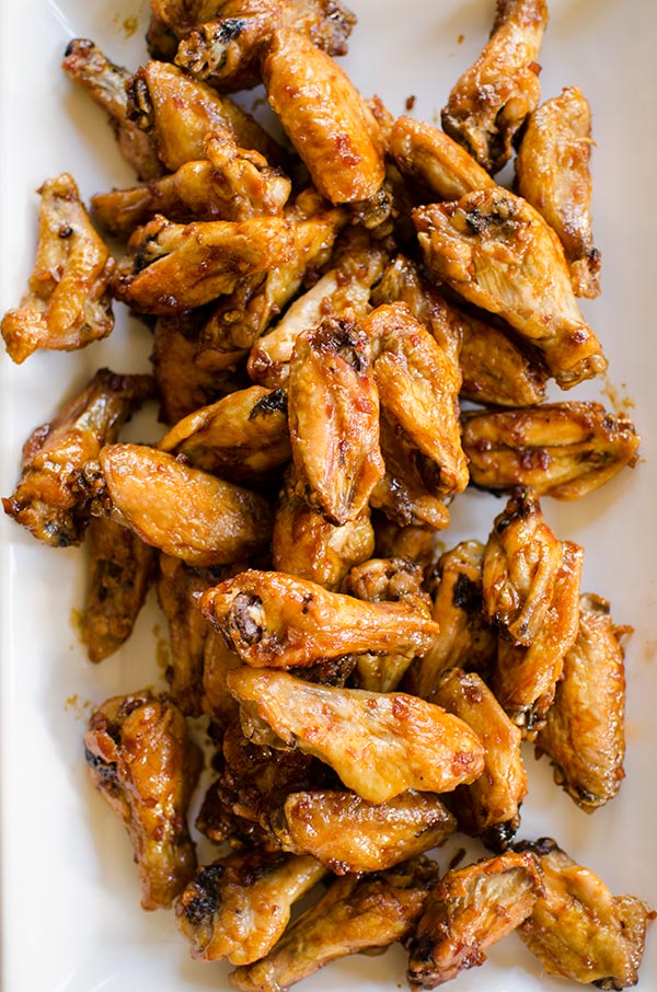 Make your favourite wings in the oven with this crispy recipe for baked teriyaki chicken wings made with baking powder and a homemade teriyaki sauce. | livinglou.com
