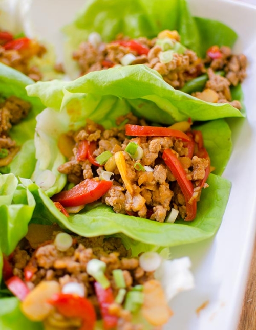 A healthy chicken lettuce wrap made with red peppers, ginger and water chestnuts. | livinglou.com