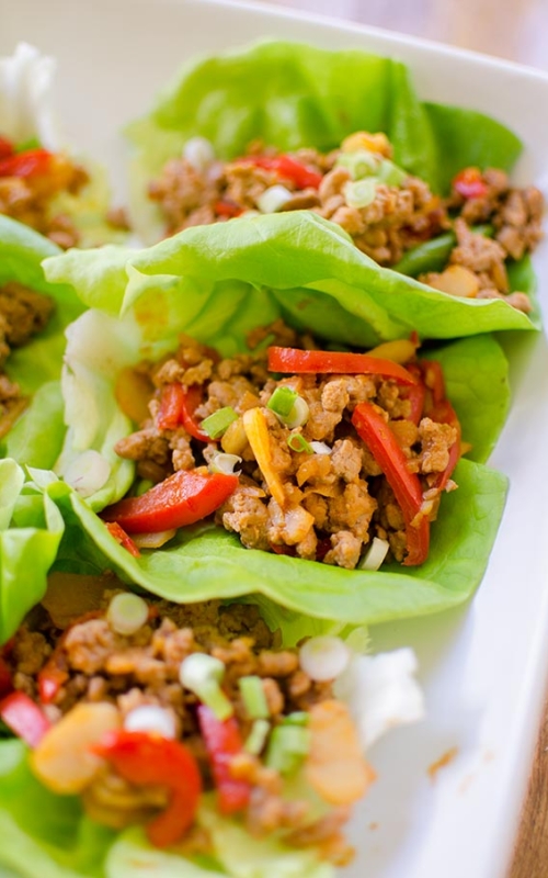 A healthy chicken lettuce wrap made with red peppers, ginger and water chestnuts. | livinglou.com