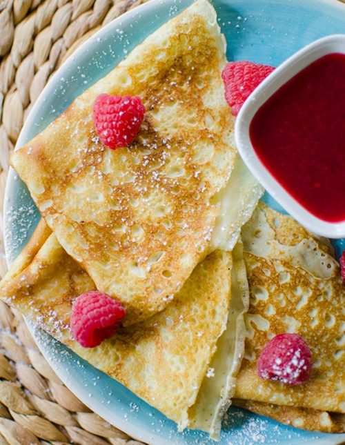 Homemade crepes with raspberry sauce. | livinglou.com