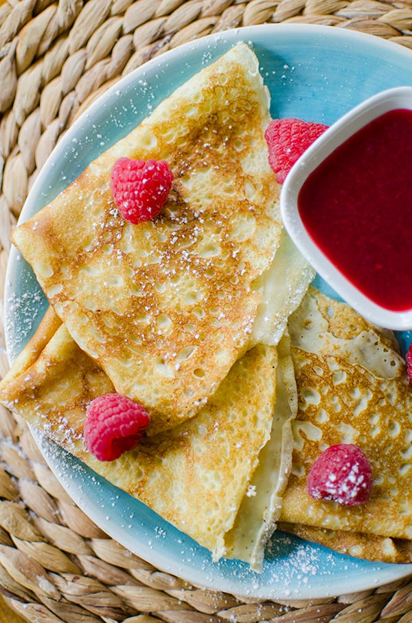 Homemade crepes with raspberry sauce. | livinglou.com