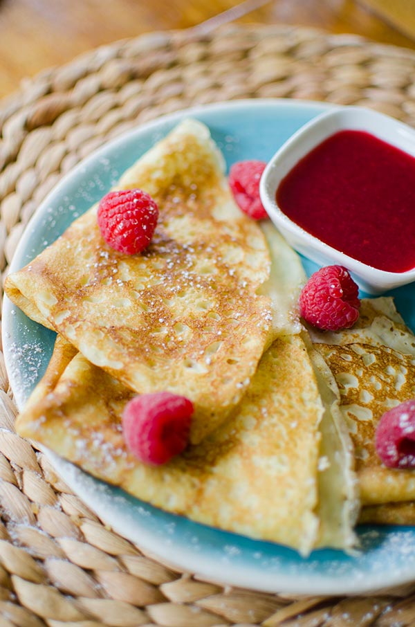 Homemade crepes with raspberry sauce. | livinglou.com