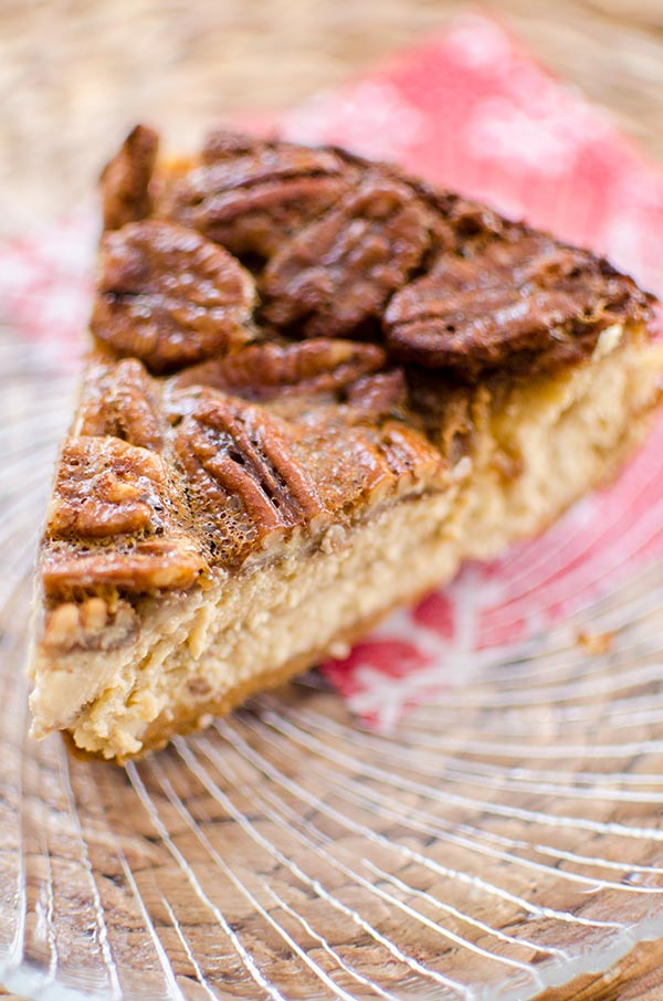 Inspired by a favourite holiday pie, this pecan pie cheesecake has a gooey pecan topping. | livinglou.com