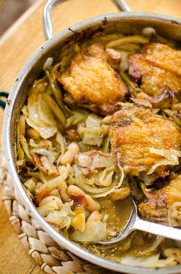 One pan braised chicken with white beans and cabbage. | livinglou.com