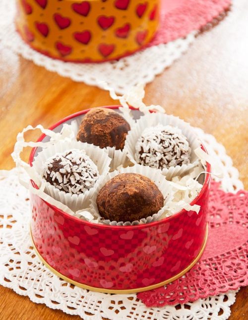 Homemade truffles in a red Valentine's Day tin.