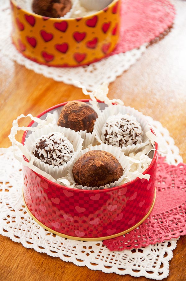 Homemade chocolate truffles in a red Valentine's Day tin