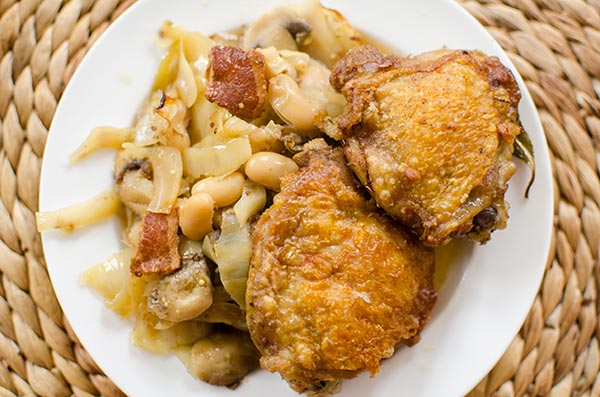 One pan braised chicken with white beans and cabbage. | livinglou.com