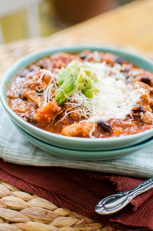 Slow cooker chicken quinoa chili is the perfect winter dish with sweet potatoes, black beans and tomatoes. | livinglou.com